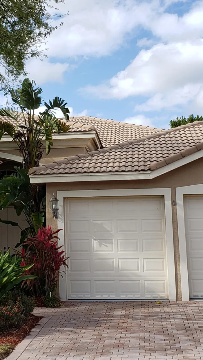 A garage and paver driveway after cleaning