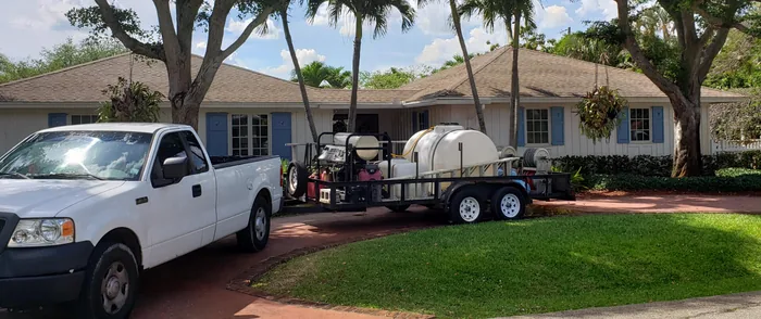 The Magic Touch truck and trailer rig at a freshly cleaned home